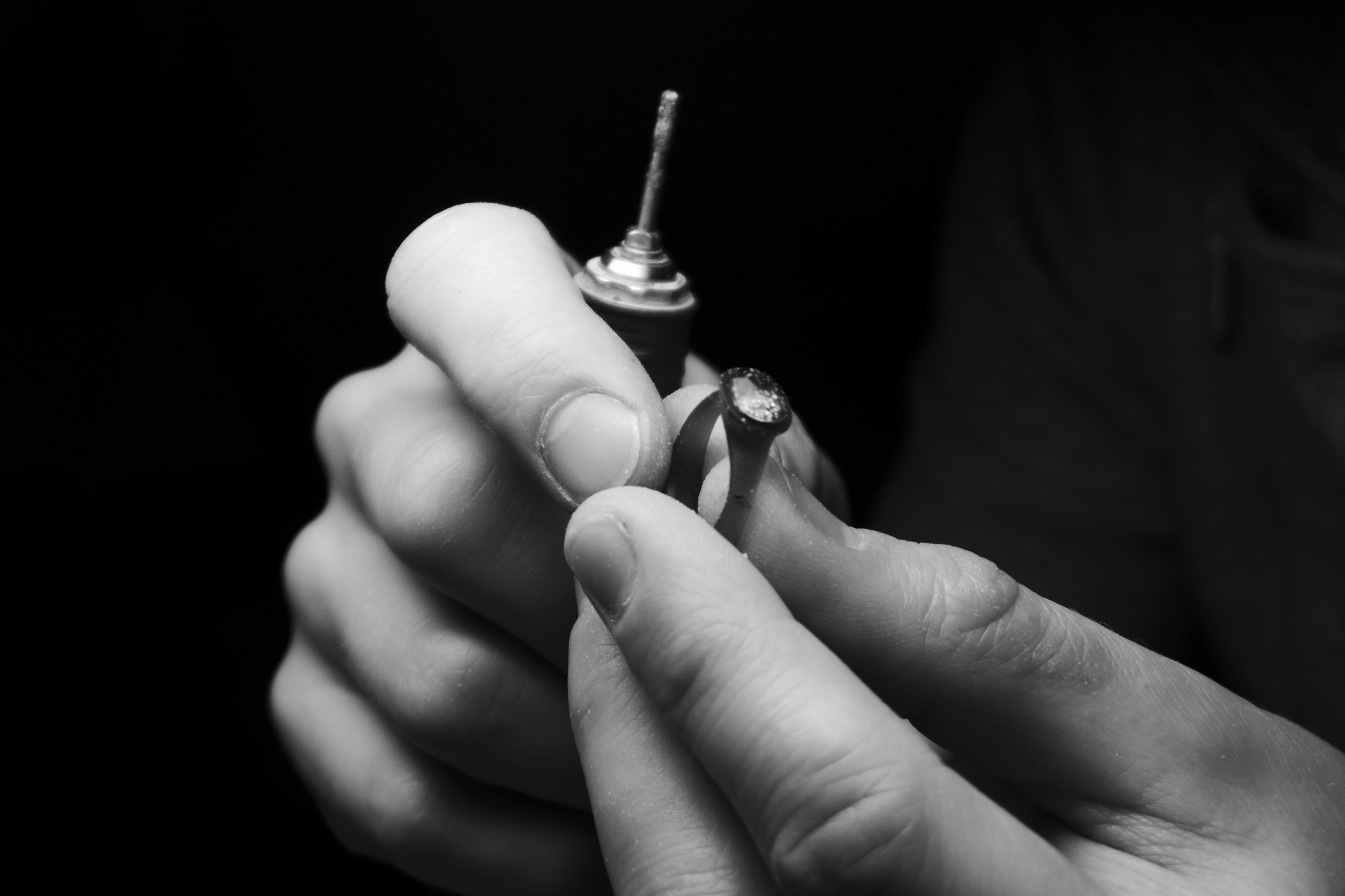 process of carving a wax model for a ring with a sapphire